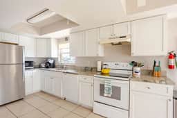 4 BR Oasis, water views every room steps to beach! - Image 3